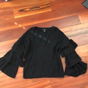Black sweater with ruffles on the sleeve!